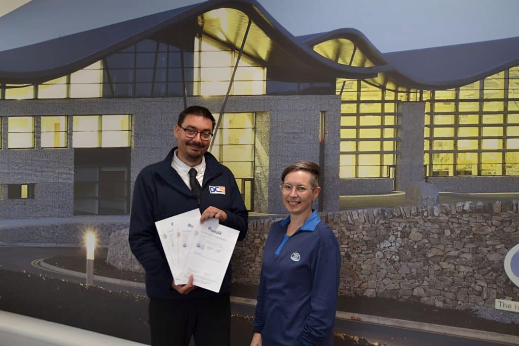 Debbie Ware, Nestle Waters Safety, Health & Environment Manager congratulates Jamie Veal, PCS SHEQ Manager on achieving 3 ISO Certifications.