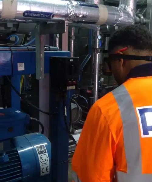 electrician looking at machinery